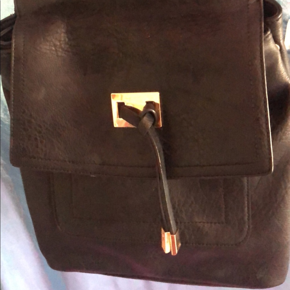 Black gold backpack with zipper